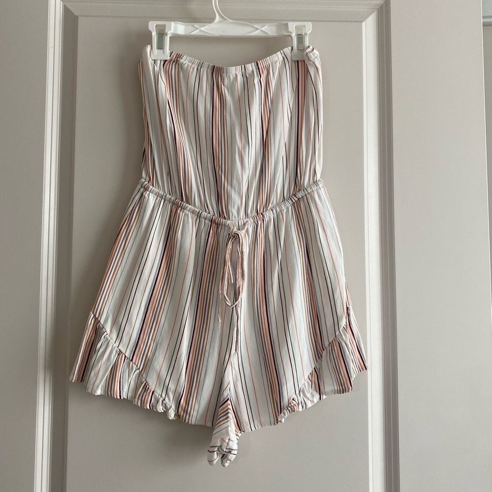 White sleeveless romper with color stripe pattern